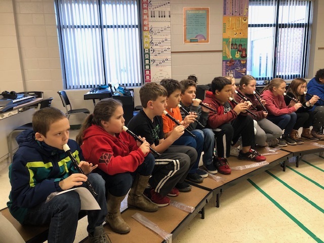 Fourth Grade students learning to play recorders