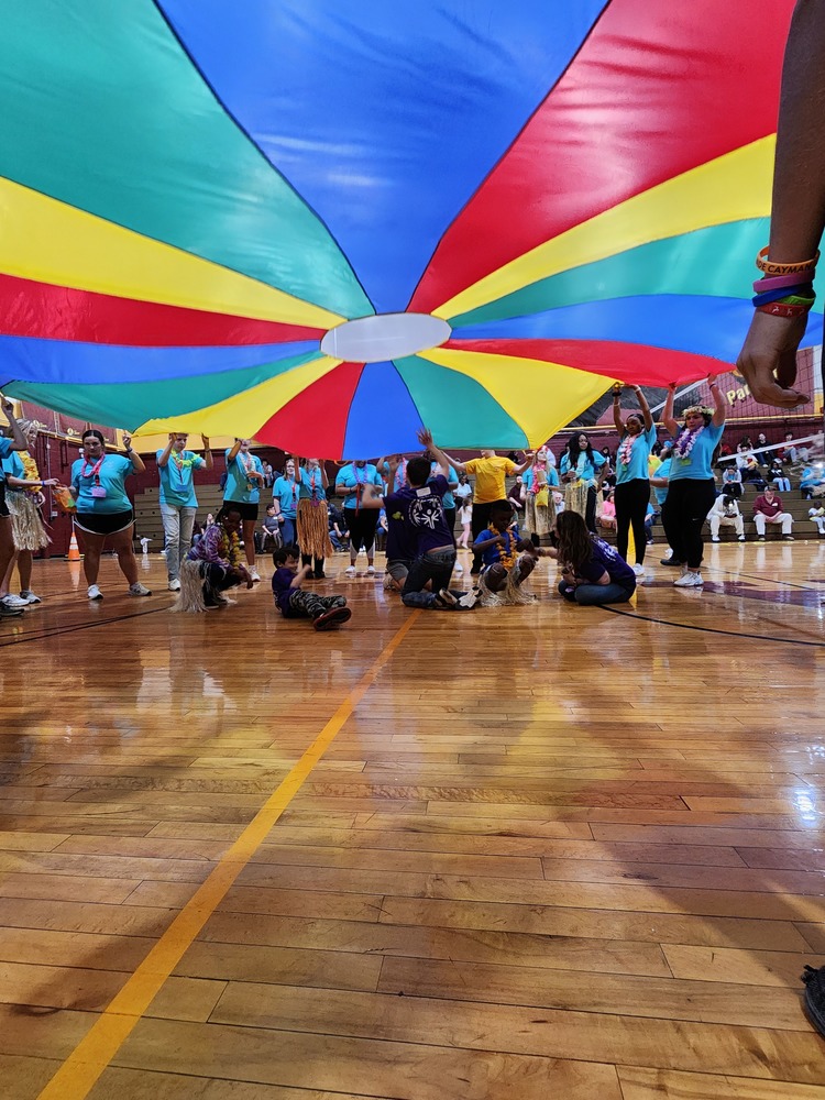 students playing with parachute