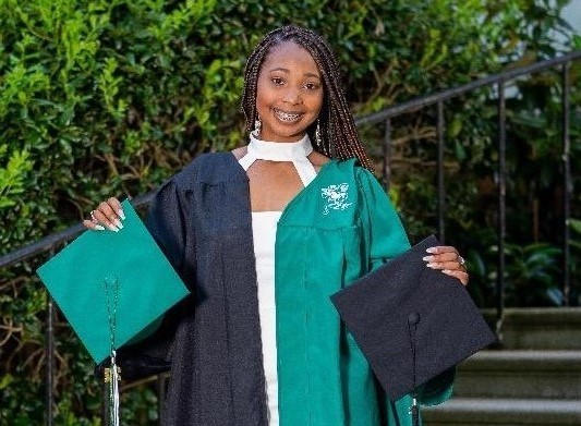 Amaiya McDowell wearing both the Piedmont Tech and Dixie graduation gowns. 