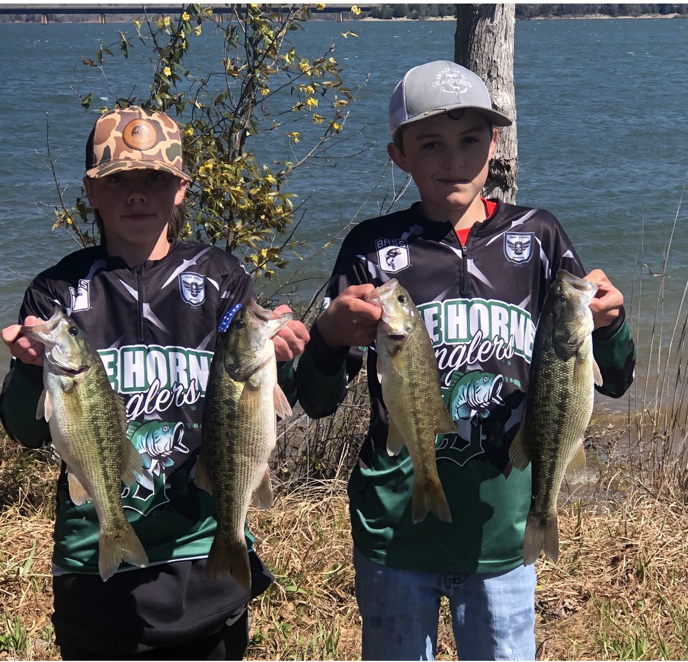 two 7th grade students at fishing tournament 