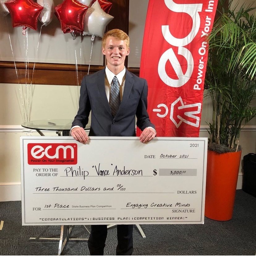 Vance Anderson holding his check