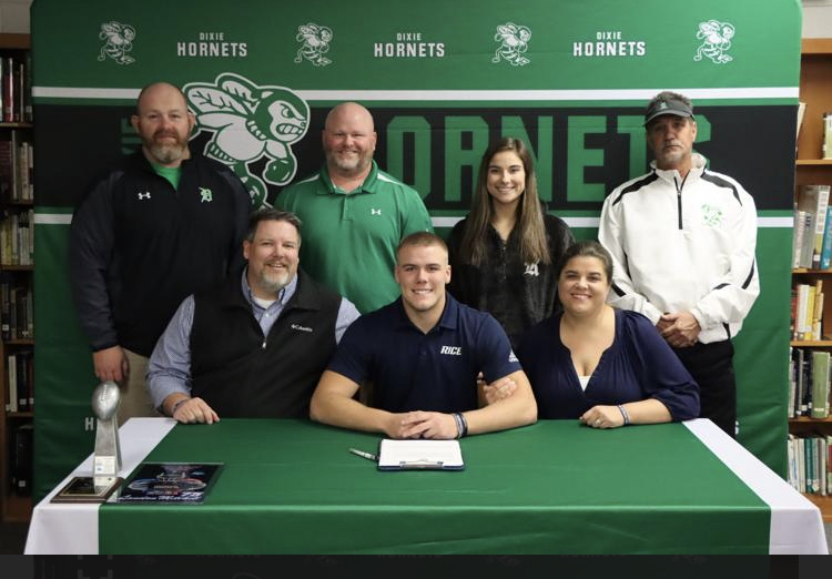 Landon Mitchell with his family and coaches