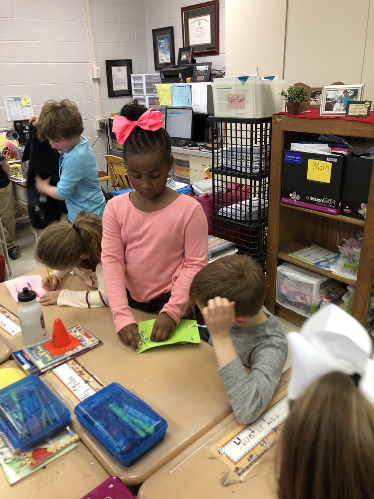 First and Second Grade students working on math