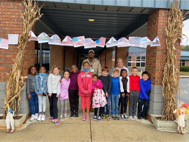 Mr. Glover and second grade students 