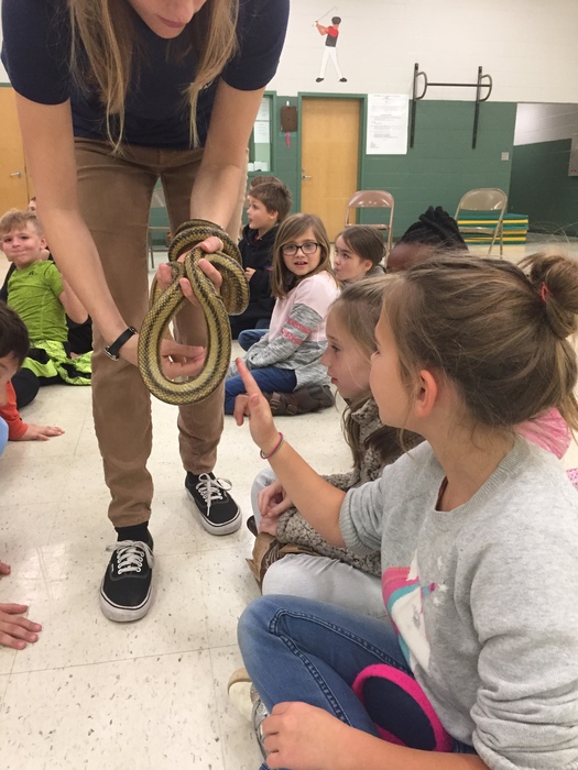 Students at CTES pet a snake from the SC Aquarium
