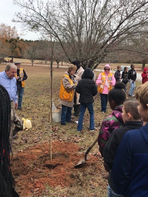 Lions Club members teaching about Arbor Day